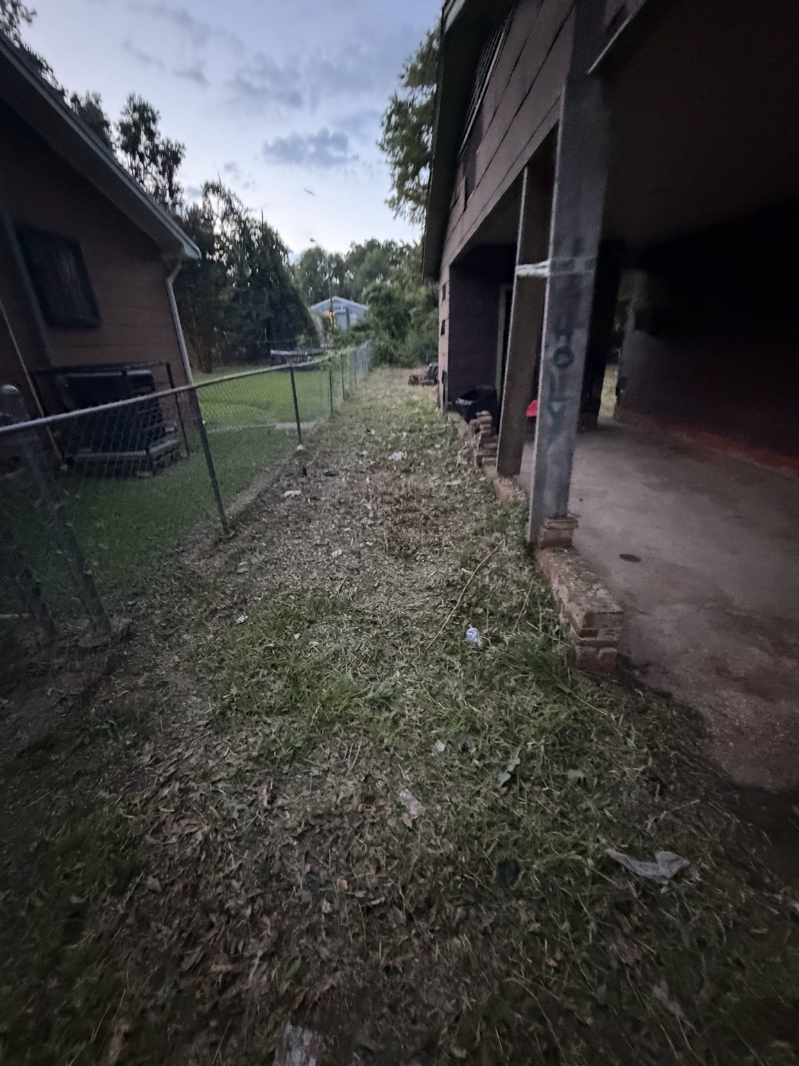 Side yard after weed cutting and cleanup in Jackson Mississippi